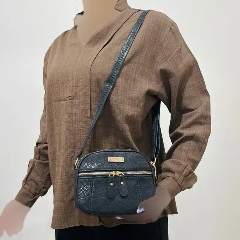 کیف زنانه چرم طرح کنفی چهار زیپ کد 1380 با بند دوشی قابل تنظیم - تصویر 7